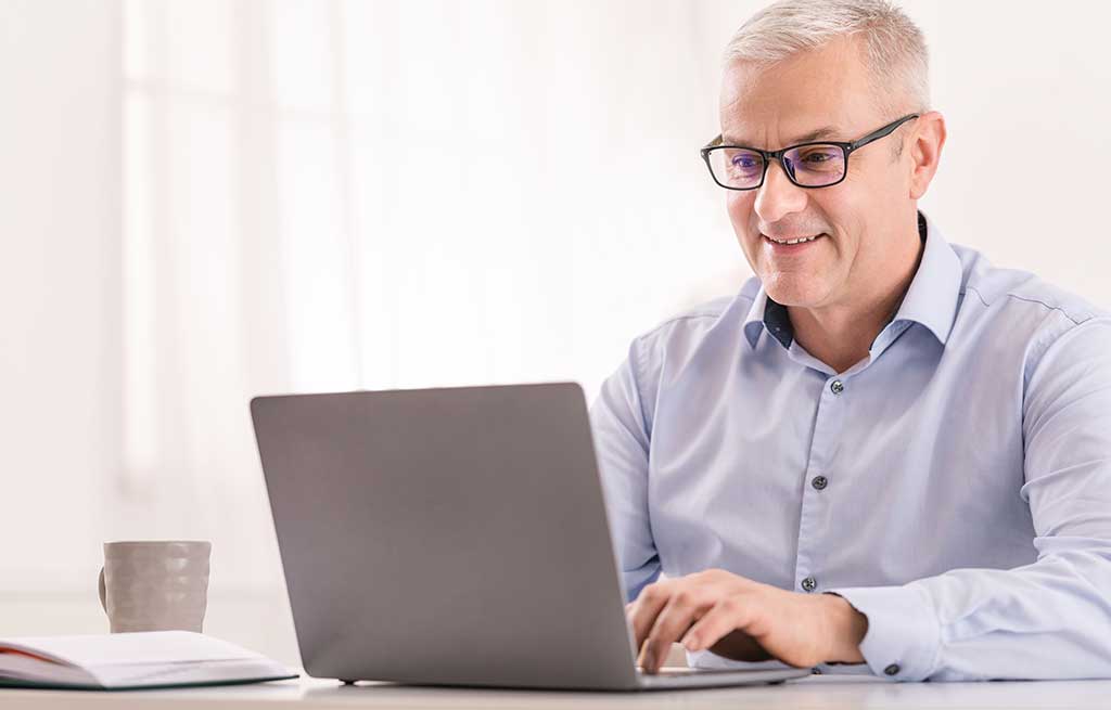 Senior doing an online search for plumbers